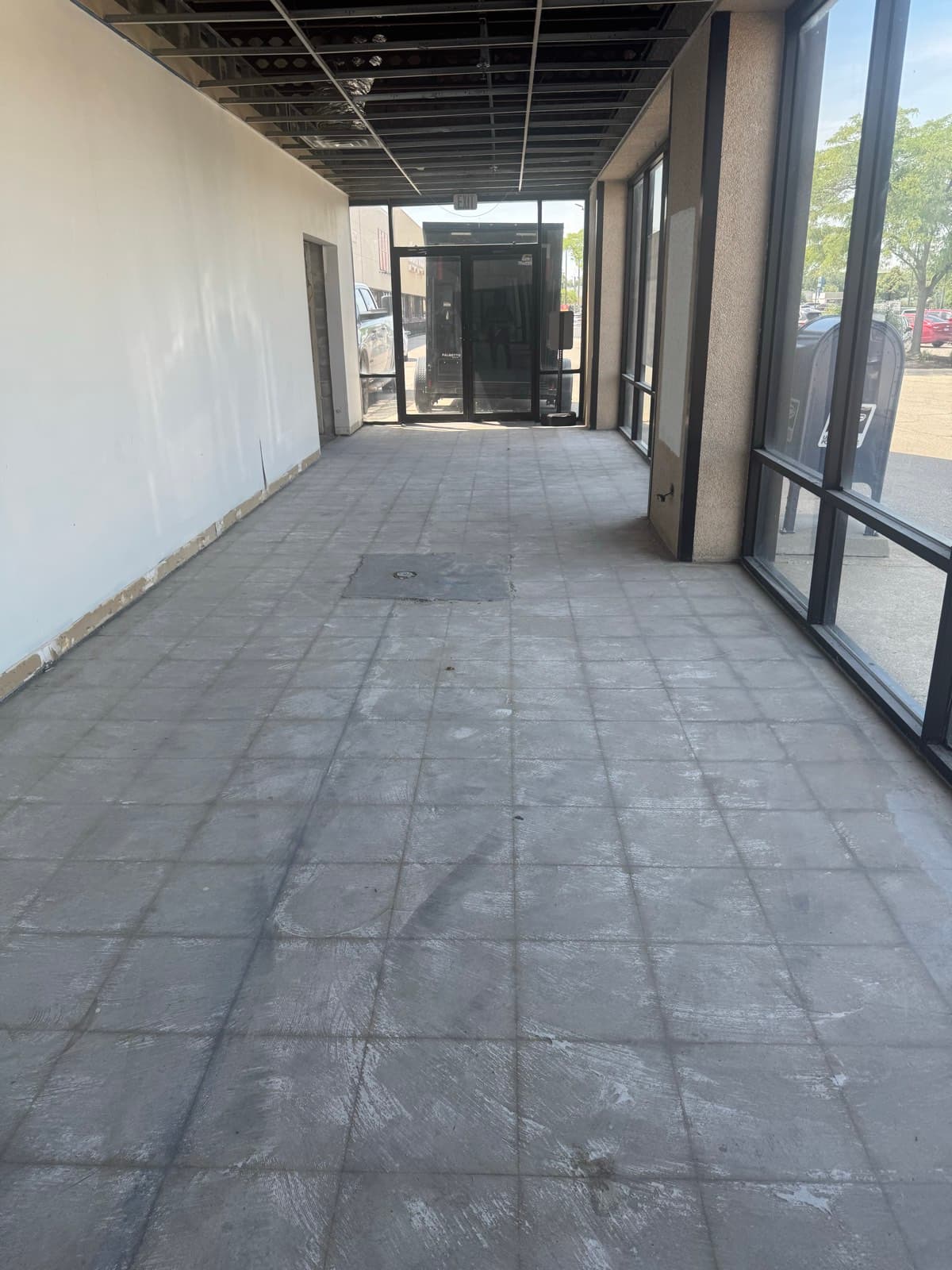 Exterior concrete prep on a commercial storefront