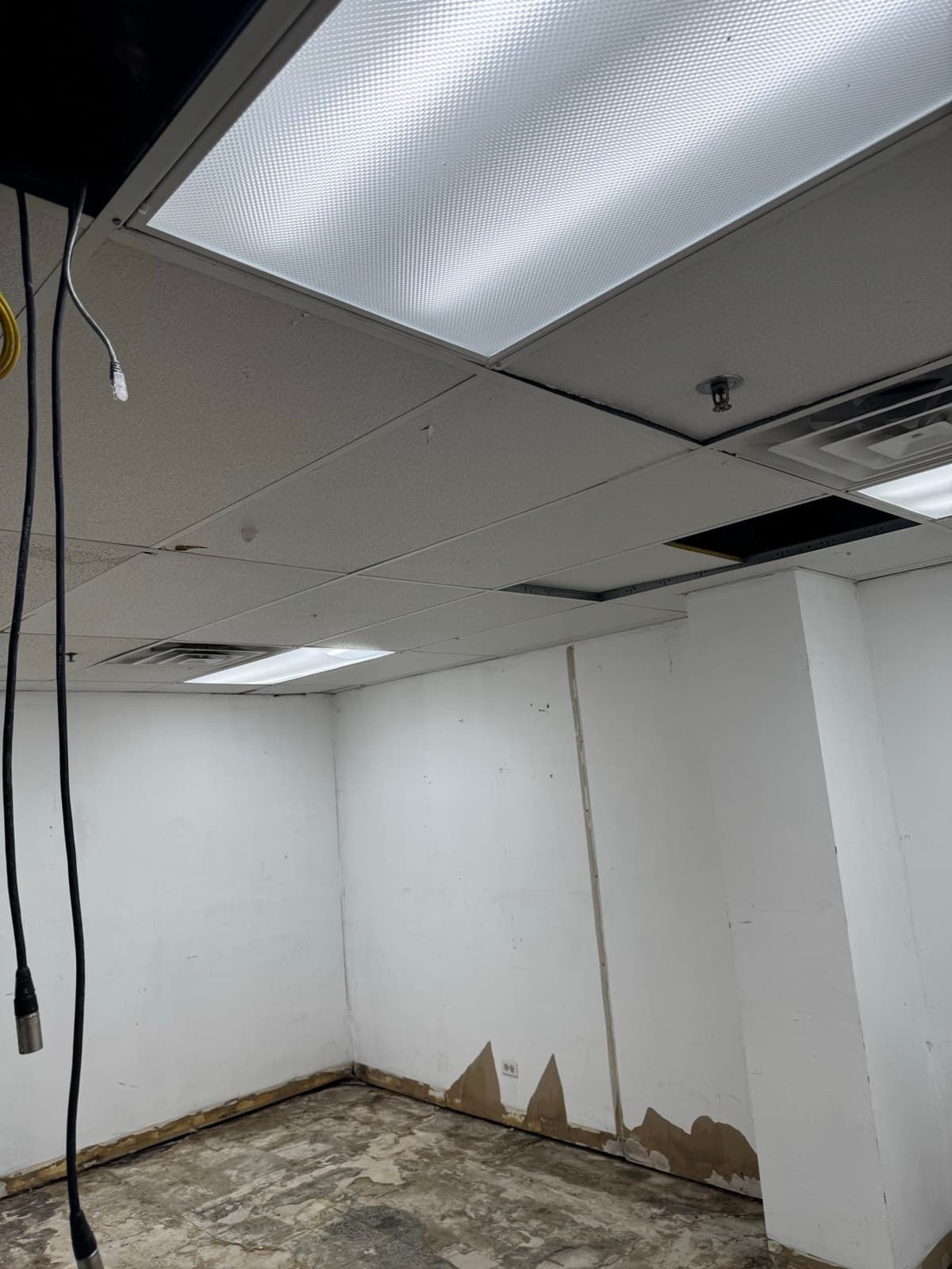 Water-damaged commercial office interior before cleanup