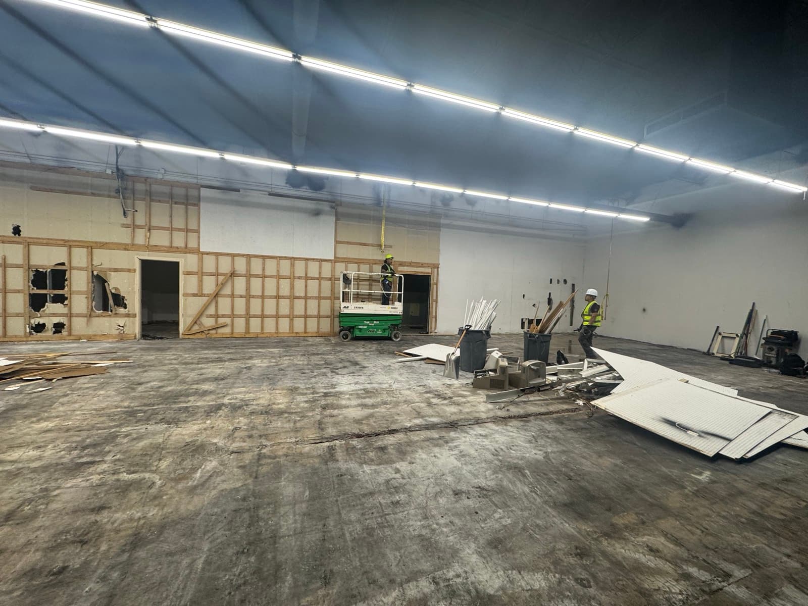 Labor crew handling interior demolition on a retail build-out